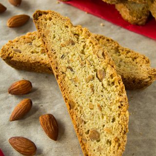 These almond anise biscotti are bursting with toasted almonds and subtle anise flavor. They can be enjoyed as a crisp cookie, or they can be baked longer the second time for a firmer biscotti that stands up to dipping into your coffee, tea, or beverage of choice.