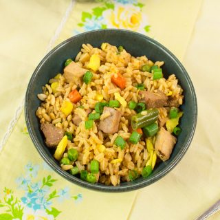 Fried rice is a great recipe to have on hand to re-purpose leftovers so they don't go to waste. This pork fried rice recipe combines leftover pork, rice, and vegetables with a tasty ginger garlic sauce for a dish that will satisfy your craving for takeout.
